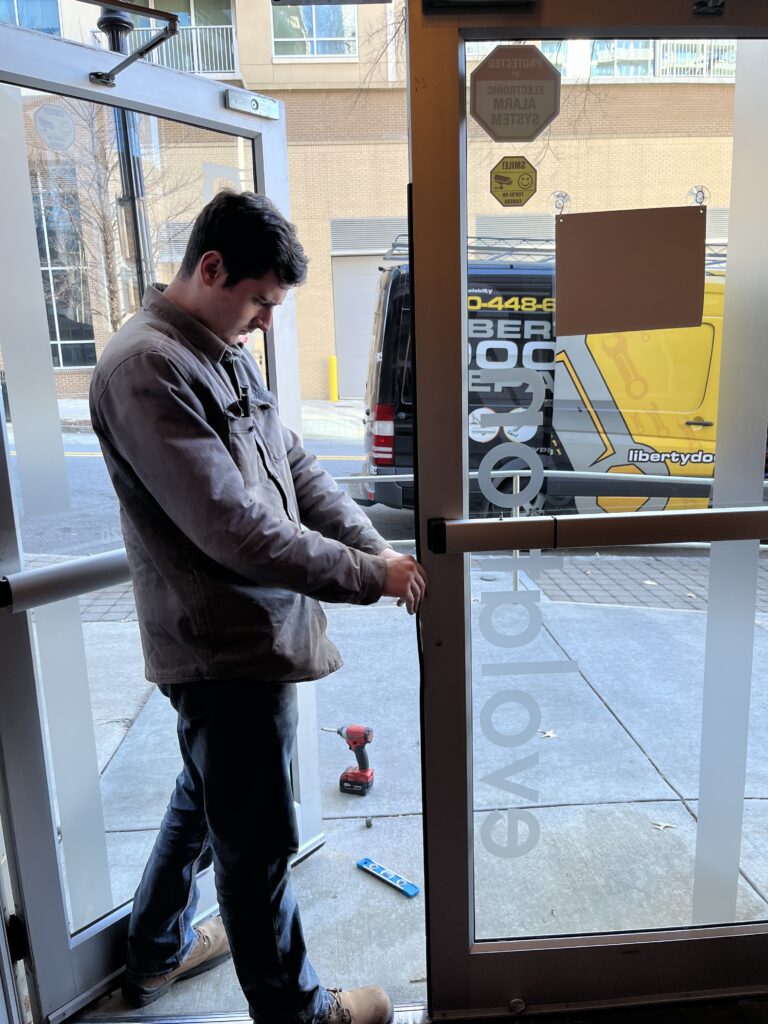 Liberty Door Repair Technician during a door repair in Decatur